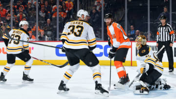 PHILADELPHIA, PA - MARCH 10: Charlie McAvoy #73 and Zdeno Chara #33 of the Boston Bruins defend as Sean Couturier #14 of the Philadelphia Flyers waits to deflect the puck onto Tuukka Rask #40 in the third period at Wells Fargo Center on March 10, 2020 in Philadelphia, Pennsylvania. The Bruins won 2-0. (Photo by Drew Hallowell/Getty Images)