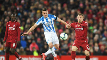 LIVERPOOL, ENGLAND - APRIL 26: Jonathan Hogg of Huddersfield Town battles with Xherdan Shaqiri of Liverpool during the Premier League match between Liverpool FC and Huddersfield Town at Anfield on April 26, 2019 in Liverpool, United Kingdom. (Photo by Michael Regan/Getty Images)