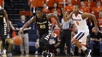 Dec 30, 2015; Charlottesville, VA, USA; Oakland Golden Grizzlies guard Kay Felder (20) steals the ball away from Virginia Cavaliers guard Devon Hall (0) during the first half at John Paul Jones Arena. Mandatory Credit: Amber Searls-USA TODAY Sports