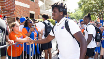 Florida Gators outside linebacker Kamran James (24) gives Gator fans high-fives during the Spring Gator Walk at Ben Hill Griffin Stadium in Gainesville, FL on Thursday, April 13, 2023 for the University of Florida Orange & Blue game. [Doug Engle/Gainesville Sun]Ncaa Football Orange And Blue Game