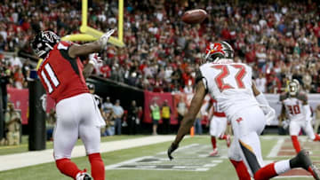 Nov 1, 2015; Atlanta, GA, USA; Atlanta Falcons wide receiver Julio Jones (11) catches the ball to score a touchdown in front of Tampa Bay Buccaneers cornerback Johnthan Banks (27) in the fourth quarter of their game at the Georgia Dome. The Buccaneers won 23-20 in overtime. Mandatory Credit: Jason Getz-USA TODAY Sports