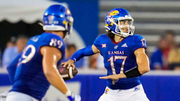 Sep 3, 2021; Lawrence, Kansas, USA; Kansas Jayhawks quarterback Jason Bean (17) throws a pass against the South Dakota Coyotes during the first half at David Booth Kansas Memorial Stadium. Mandatory Credit: Jay Biggerstaff-USA TODAY Sports