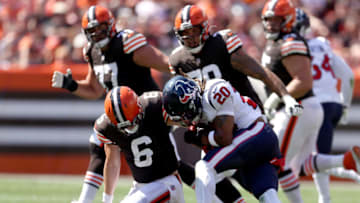CLEVELAND, OHIO - SEPTEMBER 19: Quarterback Baker Mayfield #6 of the Cleveland Browns is hit by strong safety Justin Reid #20 of the Houston Texans during the first half at FirstEnergy Stadium on September 19, 2021 in Cleveland, Ohio. (Photo by Gregory Shamus/Getty Images)