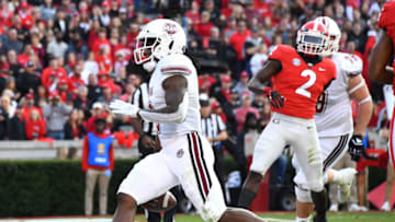 ATHENS, GA - NOVEMBER 17: Marquis Young #8 of the Massachusetts Minutemen scores a first quarter touchdown against the Georgia Bulldogs on November 17, 2018 at Sanford Stadium in Athens, Georgia. (Photo by Scott Cunningham/Getty Images)
