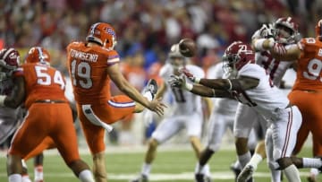 Dec 3, 2016; Atlanta, GA, USA; Alabama Crimson Tide running back Derrick Gore (27) blocks a punt attempt by Florida Gators punter Johnny Townsend (19) during the first quarter of the SEC Championship college football game at Georgia Dome. Mandatory Credit: Dale Zanine-USA TODAY Sports