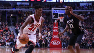 Feb 27, 2015; Chicago, IL, USA; Chicago Bulls guard Jimmy Butler (21) drives on Minnesota Timberwolves forward Andrew Wiggins (22) during the second half at the United Center. Chicago won 96-89. Mandatory Credit: Dennis Wierzbicki-USA TODAY Sports