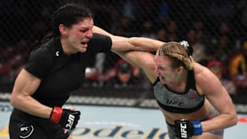 HOUSTON, TEXAS - FEBRUARY 08: (R-L) Andrea Lee punches Lauren Murphy in their women's flyweight bout during the UFC 247 event at Toyota Center on February 08, 2020 in Houston, Texas. (Photo by Josh Hedges/Zuffa LLC via Getty Images)