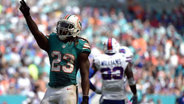 Oct 23, 2016; Miami Gardens, FL, USA; Miami Dolphins running back Jay Ajayi (23) singles for a first down during the first half against the Buffalo Bills at Hard Rock Stadium. Mandatory Credit: Steve Mitchell-USA TODAY Sports