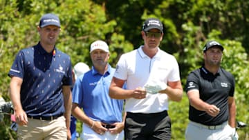 NEW ORLEANS, LOUISIANA - APRIL 22: Justin Rose of England, Ryan Palmer, Henrik Stenson of Sweden and Jon Rahm of Spain walk from the second tee during the first round of the Zurich Classic of New Orleans at TPC Louisiana on April 22, 2021 in New Orleans, Louisiana. (Photo by Stacy Revere/Getty Images)