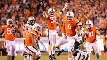 CHARLOTTESVILLE, VA - SEPTEMBER 06: Zane Zandier #33 jumps in celebration after Jordan Mack #4 of the Virginia Cavaliers sacks Hollis Mathis #12 of the William & Mary Tribe in the first half during a game at Scott Stadium on September 6, 2019 in Charlottesville, Virginia. (Photo by Ryan M. Kelly/Getty Images)
