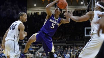 Feb 13, 2016; Boulder, CO, USA; Washington Huskies guard Dejounte Murray (5) attempts to regain control of the basketball in the second half against the Colorado Buffaloes at the Coors Events Center. The Buffaloes defeated the Huskies 81-80. Mandatory Credit: Ron Chenoy-USA TODAY Sports