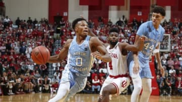 Nov 30, 2016; Bloomington, IN, USA; North Carolina Tar Heels guard Nate Britt (0) drives to the basket against Indiana Hoosiers guard Robert Johnson (4) at Assembly Hall. Indiana defeated North Carolina 76-67. Mandatory Credit: Brian Spurlock-USA TODAY Sports