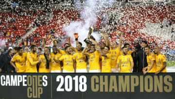 Tigres UANL team celebrates a 3-1 win against Toronto FC and hold the Campeones Cup at BMO Field in Toronto, Ontario, September 19, 2018. (Photo by Lars Hagberg / AFP) (Photo credit should read LARS HAGBERG/AFP/Getty Images)