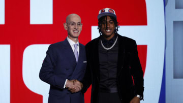 NBA commissioner Adam Silver (L) and Jaden Ivey pose for photos after Ivey was drafted with the 5th overall pick by the Detroit Pistons during the 2022 NBA Draft at Barclays Center on June 23, 2022 in New York City. NOTE TO USER: User expressly acknowledges and agrees that, by downloading and or using this photograph, User is consenting to the terms and conditions of the Getty Images License Agreement. (Photo by Sarah Stier/Getty Images)