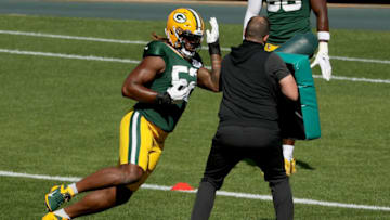 GREEN BAY, WISCONSIN - AUGUST 20: Rashan Gary #52 of the Green Bay Packers participates in a drill during Green Bay Packers Training Camp at Lambeau Field on August 20, 2020 in Green Bay, Wisconsin. (Photo by Dylan Buell/Getty Images)