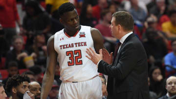 LUBBOCK, TX - JANUARY 23: Head coach Chris Beard of the Texas Tech Red Raiders talks with Norense Odiase #32 of the Texas Tech Red Raiders as he leaves the court during the first half of the game between the Texas Tech Red Raiders and the Oklahoma State Cowboys on January 23, 2018 at United Supermarket Arena in Lubbock, Texas. (Photo by John Weast/Getty Images)