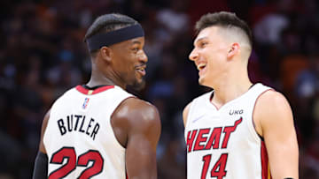 Jimmy Butler #22 and Tyler Herro #14 of the Miami Heat celebrate against the Charlotte Hornets(Photo by Michael Reaves/Getty Images)