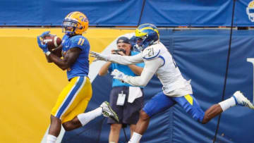 Pitt's Taysir Mack grabs a 12-yard pass for the eventual winning points in front of Delaware defensive back Justis Henley in the fourth quarter of Delaware's 17-14 loss at Heinz Field Saturday.Ud V Pitt