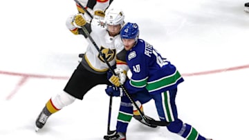 EDMONTON, ALBERTA - SEPTEMBER 03: William Karlsson #71 of the Vegas Golden Knights and Elias Pettersson #40 of the Vancouver Canucks battle for position during the third period in Game Six of the Western Conference Second Round during the 2020 NHL Stanley Cup Playoffs at Rogers Place on September 03, 2020 in Edmonton, Alberta, Canada. (Photo by Bruce Bennett/Getty Images)