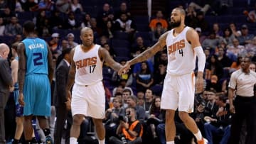 Jan 6, 2016; Phoenix, AZ, USA; Phoenix Suns forward P.J. Tucker (17) and center Tyson Chandler (4) high five on the court against the Charlotte Hornets at Talking Stick Resort Arena. Mandatory Credit: Jennifer Stewart-USA TODAY Sports