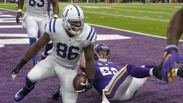 Dec 18, 2016; Minneapolis, MN, USA; Indianapolis Colts tight end Erik Swoope (86) celebrates his touchdown in front of Minnesota Vikings linebacker Chad Greenway (52) in the second quarter at U.S. Bank Stadium. Mandatory Credit: Bruce Kluckhohn-USA TODAY Sports
