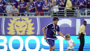 Oct 23, 2016; Orlando, FL, USA; Orlando City SC midfielder Kaka (10) plays a quick game on the field after the match against D.C. United at Camping World Stadium. Orlando City SC Players were joined by their families on the field after the game which was the last one at Camping World Stadium Mandatory Credit: Jonathan Dyer-USA TODAY Sports