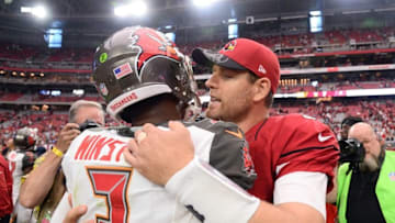 Sep 18, 2016; Glendale, AZ, USA; Tampa Bay Buccaneers quarterback Jameis Winston (3) and Arizona Cardinals quarterback Carson Palmer (3) hug at end of game at University of Phoenix Stadium. The Cardinals won 40-7. Mandatory Credit: Joe Camporeale-USA TODAY Sports