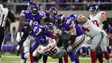 Oct 3, 2016; Minneapolis, MN, USA; New York Giants running back Orleans Darkwa (26) is tackled by Minnesota Vikings defensive tackle Linval Joseph (98) and defensive end Brian Robison (96) during the first quarter at U.S. Bank Stadium. Mandatory Credit: Brace Hemmelgarn-USA TODAY Sports