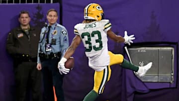 MINNEAPOLIS, MINNESOTA - DECEMBER 23: Running back Aaron Jones #33 of the Green Bay Packers rushes for a touchdown in the fourth quarter of the game against the Minnesota Vikings at U.S. Bank Stadium on December 23, 2019 in Minneapolis, Minnesota. (Photo by Stephen Maturen/Getty Images)