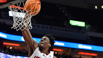 Feb 1, 2023; Louisville, Kentucky, USA; Louisville Cardinals forward Emmanuel Okorafor (34) dunks against Georgia Tech Yellow Jackets forward Javon Franklin (4) during the second half at KFC Yum! Center. Louisville defeated Georgia Tech 68-58. Mandatory Credit: Jamie Rhodes-USA TODAY Sports