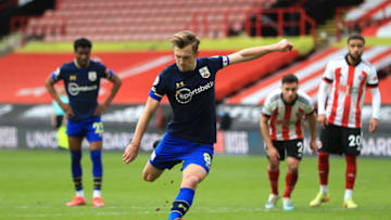 SHEFFIELD, ENGLAND - MARCH 06: James Ward-Prowse of Southampton scores their side's first goal from the penalty spot during the Premier League match between Sheffield United and Southampton at Bramall Lane on March 06, 2021 in Sheffield, England. Sporting stadiums around the UK remain under strict restrictions due to the Coronavirus Pandemic as Government social distancing laws prohibit fans inside venues resulting in games being played behind closed doors. (Photo by Mike Egerton - Pool/Getty Images)