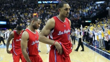 Apr 27, 2013; Memphis, TN, USA; Los Angeles Clippers center Ryan Hollins (15) and guards Willie Green (34) and Eric Bledsoe (12) walk off of the court after game four of the first round of the 2013 NBA playoffs against the Memphis Grizzlies at the FedEx Forum. Memphis defeated Los Angeles 104-83. Mandatory Credit: Nelson Chenault-USA TODAY Sports