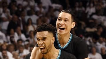 Apr 27, 2016; Miami, FL, USA; Charlotte Hornets guard Jeremy Lin (7) jumps on the back of Hornets guard Courtney Lee (1) in celebration during the second half in game five of the first round of the NBA Playoffs against the Miami Heat at American Airlines Arena. Mandatory Credit: Steve Mitchell-USA TODAY Sports
