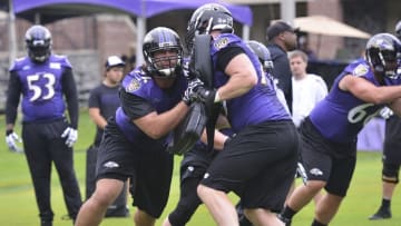 Jul 24, 2014; Owings Mills, MD, USA; Baltimore Ravens tackle Jah Reid (76) blocks tackle Parker Graham (79) during practice at Under Armour Performance Center. Mandatory Credit: Tommy Gilligan-USA TODAY Sports