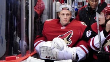 Feb 18, 2016; Glendale, AZ, USA; Arizona Coyotes goalie Niklas Treutle (60) looks on prior to the game against the Dallas Stars at Gila River Arena. Mandatory Credit: Matt Kartozian-USA TODAY Sports