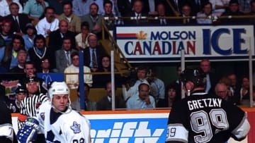 TORONTO, ON - MAY 17: Wayne Gretzky #99 of the Los Angeles Kings skates by Doug Gilmour #93 of the Toronto Maple Leafs during NHL semi final series playoff game action on May 17, 1993 at Maple Leaf Gardens in Toronto, Ontario Canada. (Photo by Graig Abel/Getty Images)