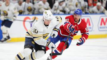 Jan 30, 2020; Buffalo, New York, USA; Buffalo Sabres defenseman Henri Jokiharju (10) skates with the puck as Montreal Canadiens left wing Tomas Tatar (90) defends during the third period at KeyBank Center. Mandatory Credit: Timothy T. Ludwig-USA TODAY Sports