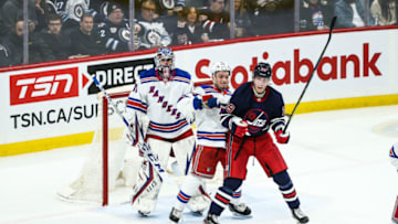 WINNIPEG, MB February 11: Winnipeg Jets forward Patrik Laine (29) jostles for position with New York Rangers defenseman Ryan Lindgren (55) during the regular season game between the Winnipeg Jets and the New York Rangers on February 11, 2020 at the Bell MTS Place in Winnipeg MB. (Photo by Terrence Lee/Icon Sportswire via Getty Images)