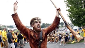 Aug 31, 2013; Morgantown, WV, USA; West Virginia Mountaineers mascot cheers as the Mountaineers team enters the stadium to host the William & Mary Tribe at Milan Puskar Stadium. Mandatory Credit: Charles LeClaire-USA TODAY Sports