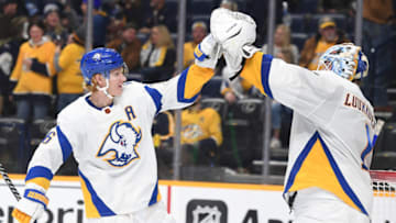 Jan 14, 2023; Nashville, Tennessee, USA; Buffalo Sabres defenseman Rasmus Dahlin (26) celebrates with goaltender Ukko-Pekka Luukkonen (1) after a win against the Nashville Predators at Bridgestone Arena. Mandatory Credit: Christopher Hanewinckel-USA TODAY Sports