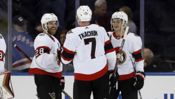 NEW YORK, NEW YORK - DECEMBER 02: Brady Tkachuk #7 of the Ottawa Senators celebrates with teammates Claude Giroux #28 and Tim Stutzle #18 after scoring the overtime game-winning goal against the New York Rangers at Madison Square Garden on December 02, 2022 in New York City. (Photo by Jim McIsaac/Getty Images)