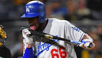 PITTSBURGH, PA - JUNE 06: Yasiel Puig #66 of the Los Angeles Dodgers licks his bat after hitting a foul ball during the eighth inning against the Pittsburgh Pirates at PNC Park on June 6, 2018 in Pittsburgh, Pennsylvania. (Photo by Joe Sargent/Getty Images)