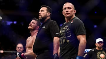 NEW YORK, NY - NOVEMBER 04: (R-L) Georges St-Pierre of Canada celebrates his submission victory over Michael Bisping of England in their UFC middleweight championship bout during the UFC 217 event inside Madison Square Garden on November 4, 2017 in New York City. (Photo by Brandon Magnus/Zuffa LLC/Zuffa LLC via Getty Images)