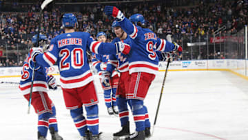 NEW YORK, NY - OCTOBER 21: Mika Zibanejad #93 of the New York Rangers celebrates with teammates after scoring a goal in the third period against the Calgary Flames at Madison Square Garden on October 21, 2018 in New York City. (Photo by Jared Silber/NHLI via Getty Images)
