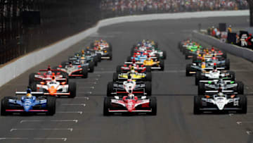 INDIANAPOLIS, IN - MAY 29: The field drives down the frontstretch on a parade lap prior to the IZOD IndyCar Series Indianapolis 500 Mile Race at Indianapolis Motor Speedway on May 29, 2011 in Indianapolis, Indiana. (Photo by Jonathan Ferrey/Getty Images)