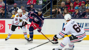 COLUMBUS, OH - OCTOBER 20: Columbus Blue Jackets left wing Anthony Duclair (91) looks for an open man as Chicago Blackhawks center David Kampf (64) prepares to block in the second period of a game between the Columbus Blue Jackets and the Chicago Blackhawks on October 20, 2018 at Nationwide Arena in Columbus, OH. (Photo by Adam Lacy/Icon Sportswire via Getty Images)