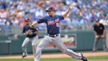 Apr 20, 2014; Kansas City, MO, USA; Minnesota Twins pitcher Brian Duensing (52) delivers a pitch against the Kansas City Royals during the seventh inning at Kauffman Stadium. The Twins won 8-3. Mandatory Credit: Peter G. Aiken-USA TODAY Sports