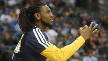 Apr 2, 2014; Denver, CO, USA; Denver Nuggets forward Kenneth Faried (35) reacts from the bench during the second half against the New Orleans Pelicans at Pepsi Center. The Nuggets won 137-107. Mandatory Credit: Chris Humphreys-USA TODAY Sports