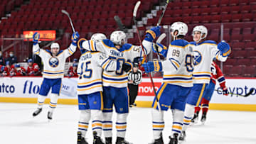 MONTREAL, QC - FEBRUARY 13: Jeff Skinner #53 of the Buffalo Sabres celebrates his fourth goal of the game with teammates during the third period against the Montreal Canadiens at Centre Bell on February 13, 2022 in Montreal, Canada. The Buffalo Sabres defeated the Montreal Canadiens 5-3. (Photo by Minas Panagiotakis/Getty Images)