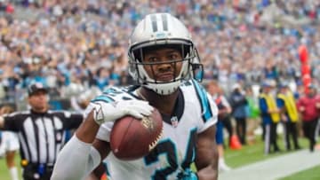 Carolina Panthers cornerback Josh Norman (24) celebrates after intercepting a pass in the fourth quarter against the New Orleans Saints at Bank of America Stadium. Carolina defeated the Saints 27-22. Mandatory Credit: Jeremy Brevard-USA TODAY Sports